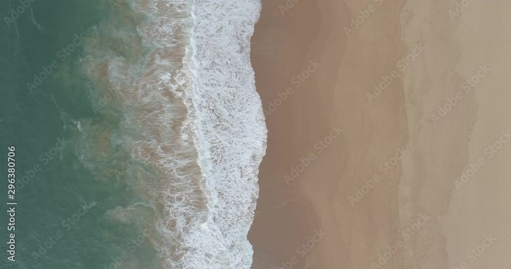 Aerial view of waves breaking on a sandy beach at Northern Beaches, Australia Aerial view of waves breaking on a sandy beach at Northern Beaches, Australia