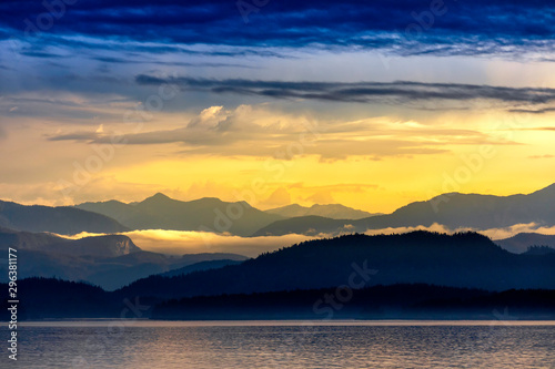 Sunrise over Mountains and Ocean Coastline © Mark