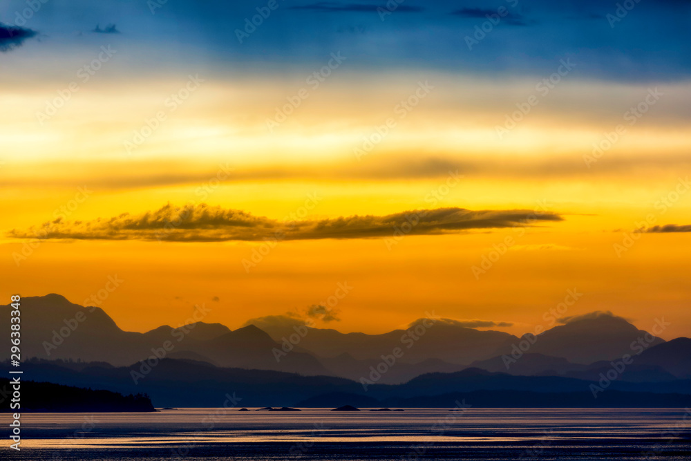 Silhouetted Mountains at Sunset at Coastline