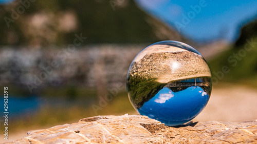 Crystal ball alpine landscape shot at Zauchensee, Salzburg, Austria © Martin Erdniss