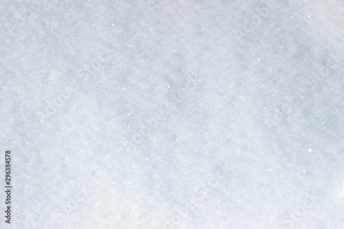 Winter snow. The texture of sparkling snow. Top view of the snow. Snowflakes texture for design.