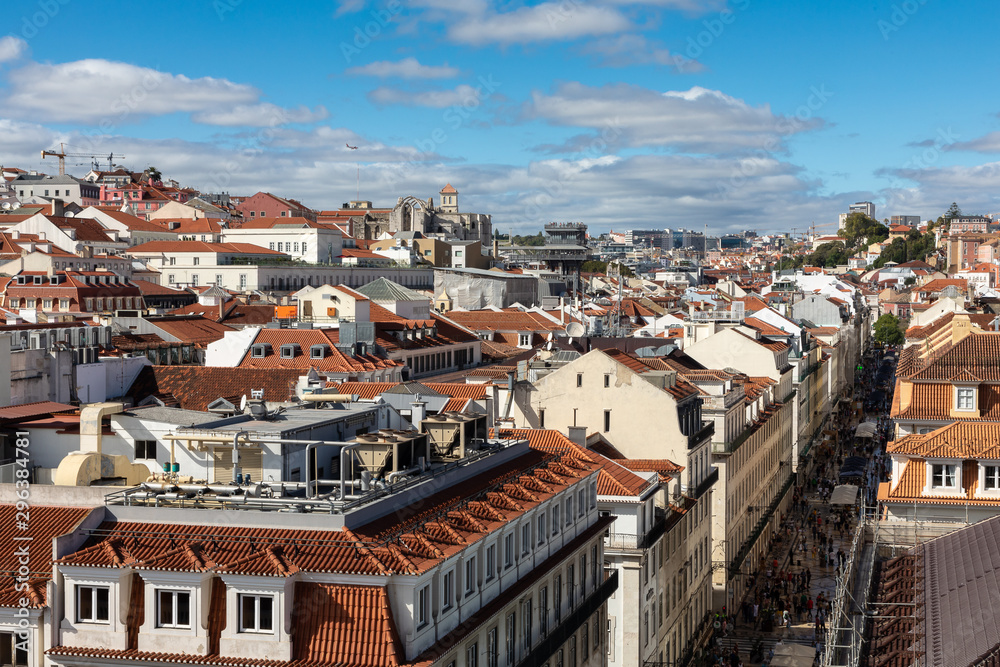 Landscape with aerial view of downtown Lisbon, Portugal on sunny day with blue sky in background