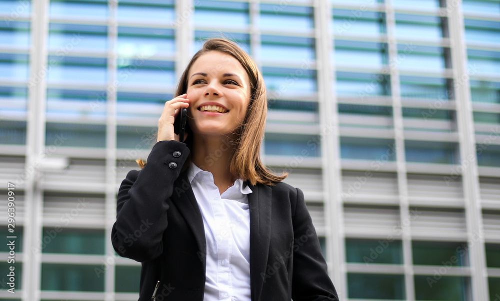 Portrait of a young woman talking on the phone Portrait of a young woman talking on the phone