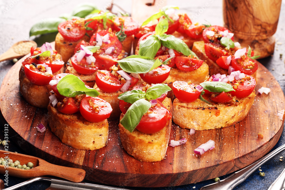 fresh tomato bruschetta. italian food appetizer with basil on table