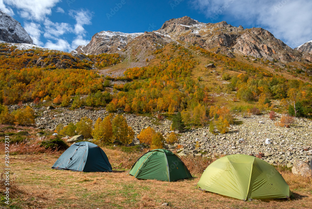 campground in the mountains against the backdrop of yellowing autumn trees in the mountains