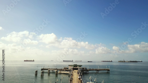 city pier with calm seas and blue sky