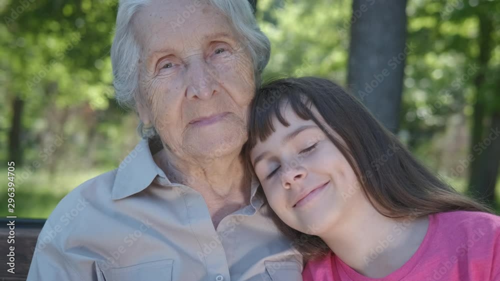 Happy grandmother with granddaughter. Happy old age. Close-up of a teenage girl with her grandmother. Happy grandmother with granddaughter. Happy old age. Close-up of a teenage girl with her grandmother.