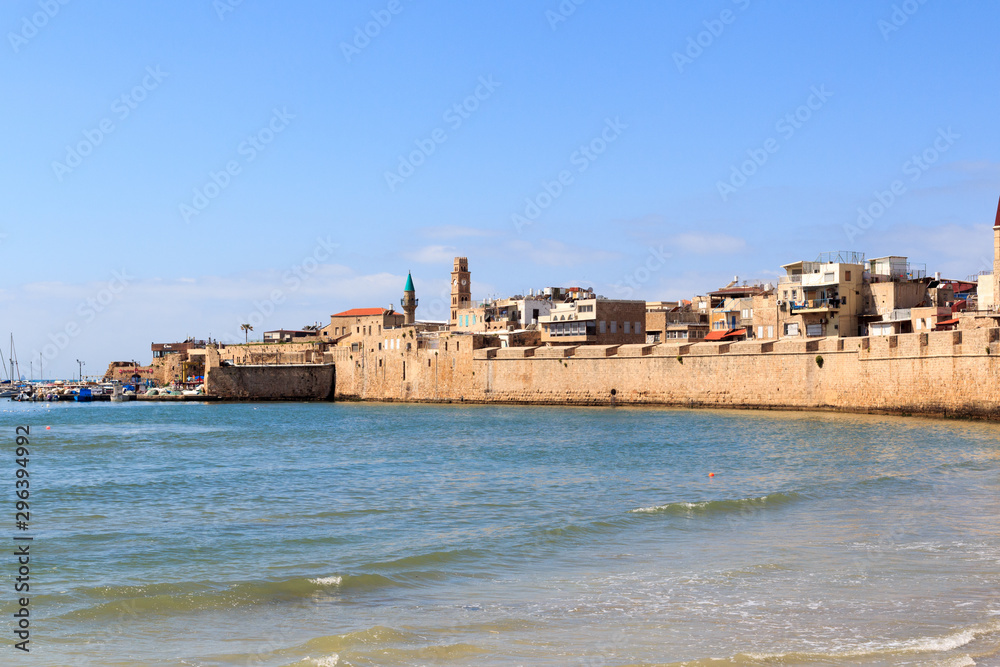Coastline panorama of Acre Old City with seawall and marina at mediterranean sea, Israel