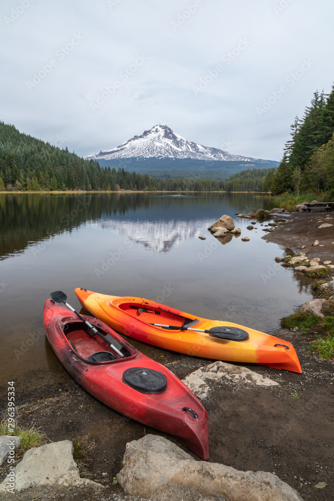 A pair of kayaks on the shore of Trillium Lake with Mt. Hood in the background