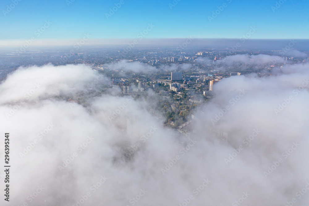 flight over the city and clouds