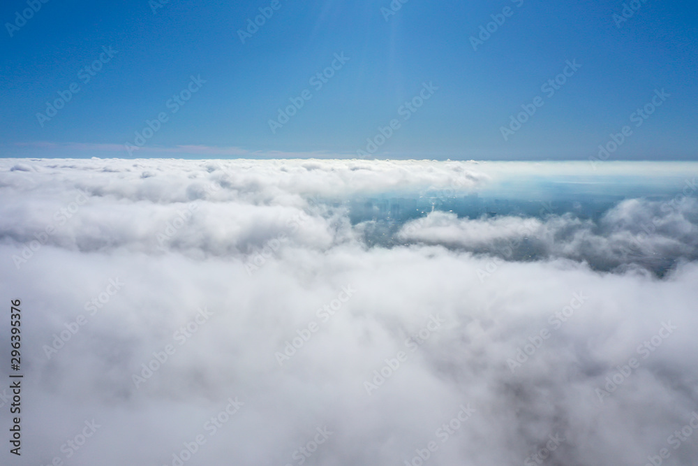 flight over the city and clouds