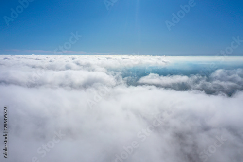 flight over the city and clouds