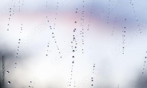 Bright wet window glass with droplets