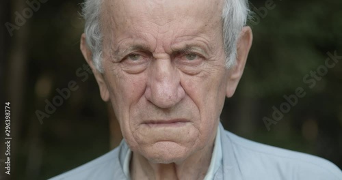 Old man face holding his wife, close up, slow motion