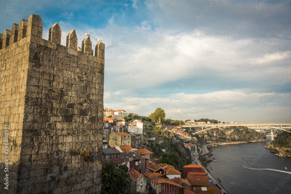 Landscape with the city Porto, part of castle Muralla Fernandina and Douro river, look from the iron bridge of Luis I