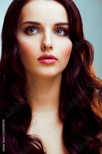 Fototapeta Naklejka Na Ścianę i Meble -  young pretty brunette woman with hairstyle waves, luxury look fashion makeup close up