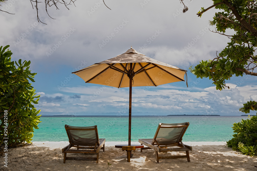 parasol and chairs on the beach of hanimaadhoo (maldives)