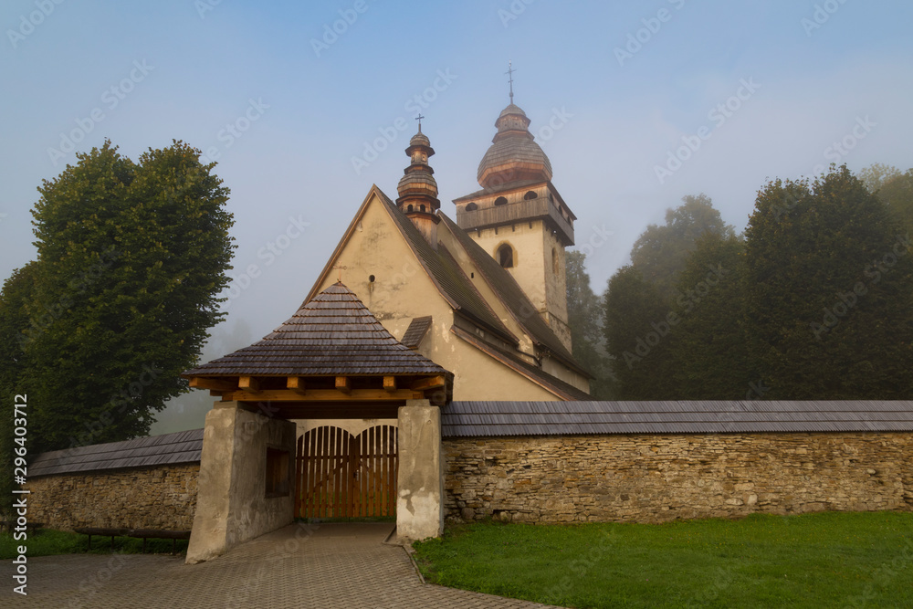 Old Gothic Catholic church outdoors, village Smrecany, Liptov region, Slovakia. Old Gothic Catholic church outdoors, village Smrecany, Liptov region, Slovakia.