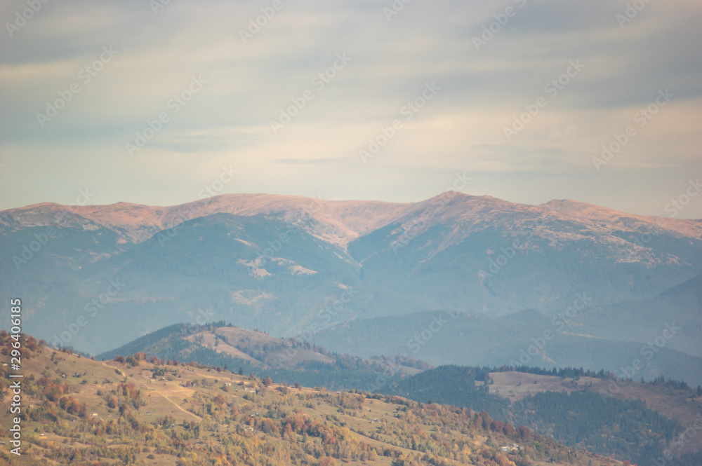 Mountains in a blue haze in autumn afternoon