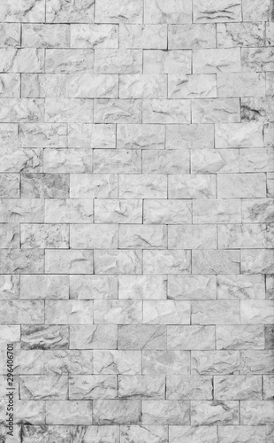High resolution full frame background of detailed new and modern brick wall in black and white.