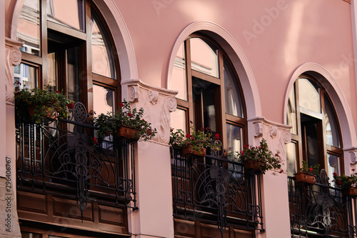 Large front windows of an old building close-up in the city center