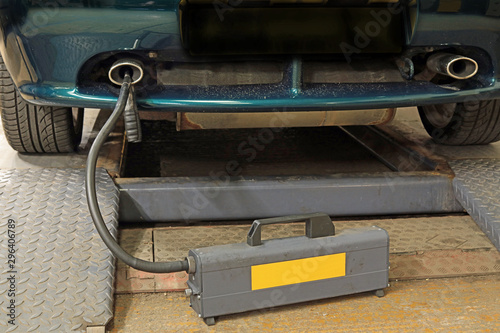 Emissions Tester Machine Receiving Data From The Exhaust Pipe Of A Vehicle
