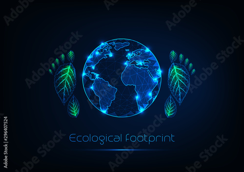 Ecological footprint concept with futuristic glow low polygonal planet Earth and human foot prints.