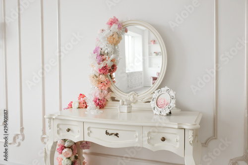 Slika na platnu Vintage style boudoir table with round mirror and flowers