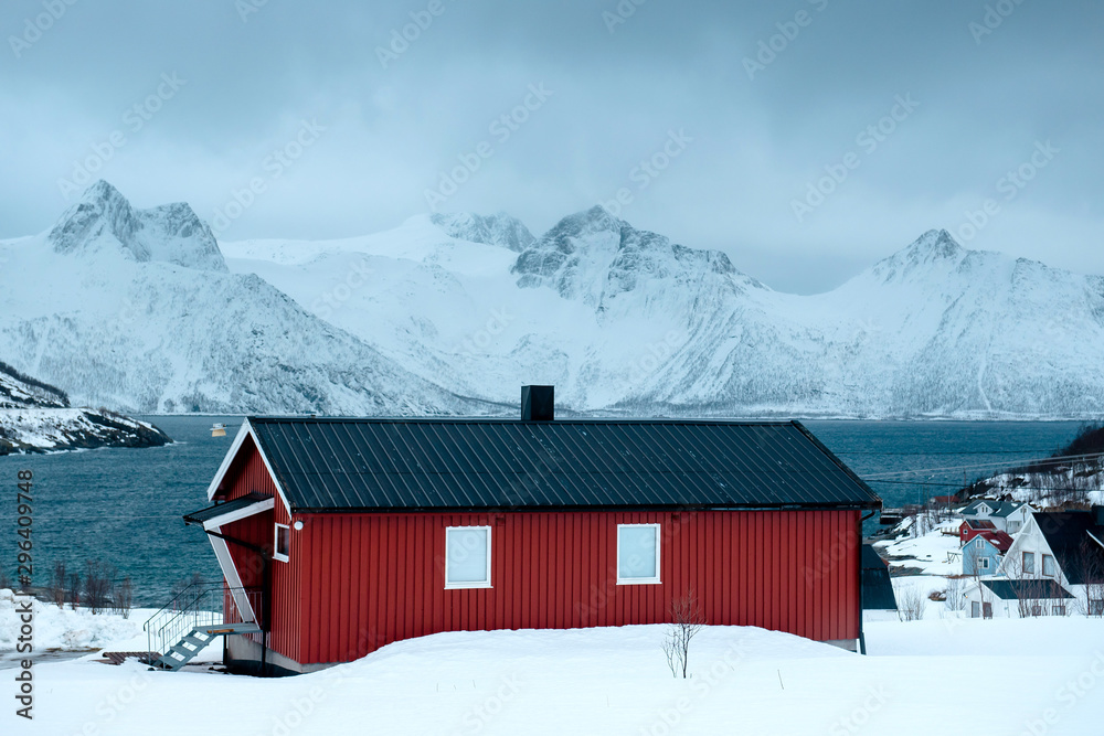 Norway. Fishing town. In background snowy mountains.