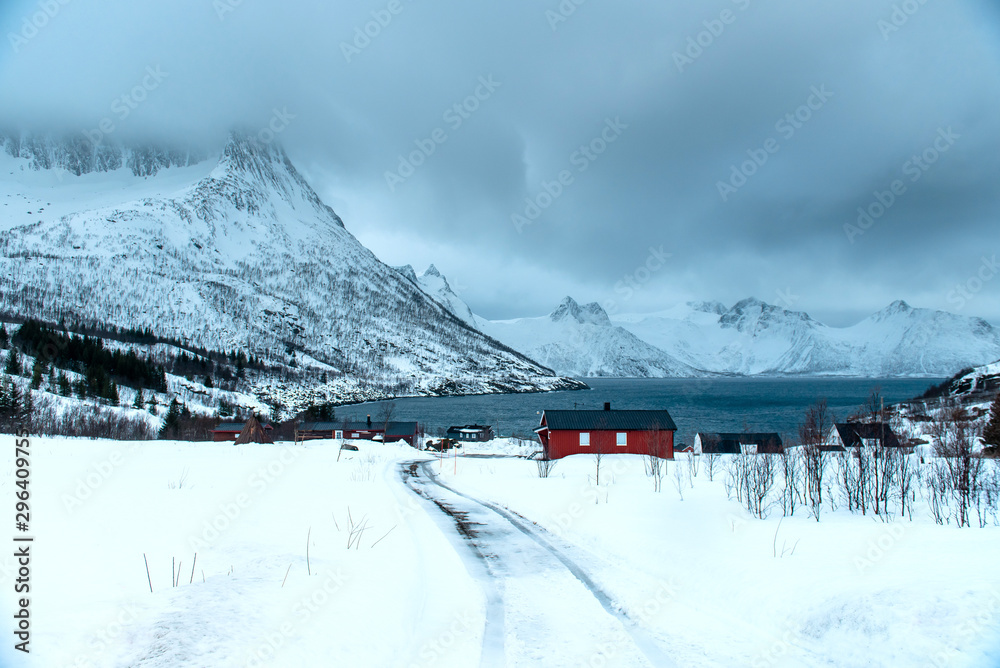 Norway. Fishing town. In background snowy mountains.