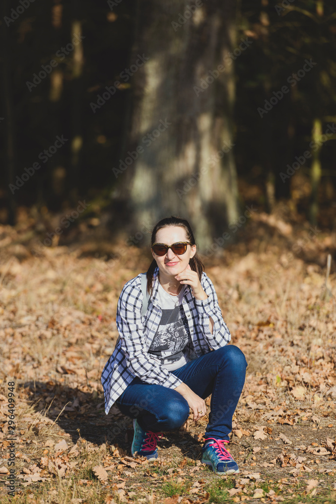 Autumn attractive woman portrait smiling outdoors at the park. Authentic and natural photographs. Autumn attractive woman portrait smiling outdoors at the park. Authentic and natural photographs.