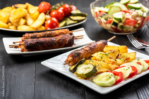 kebab on sticks served with vegetables