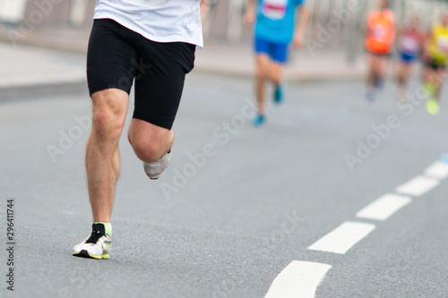 Marathon race. Closeup of the feet of a runner