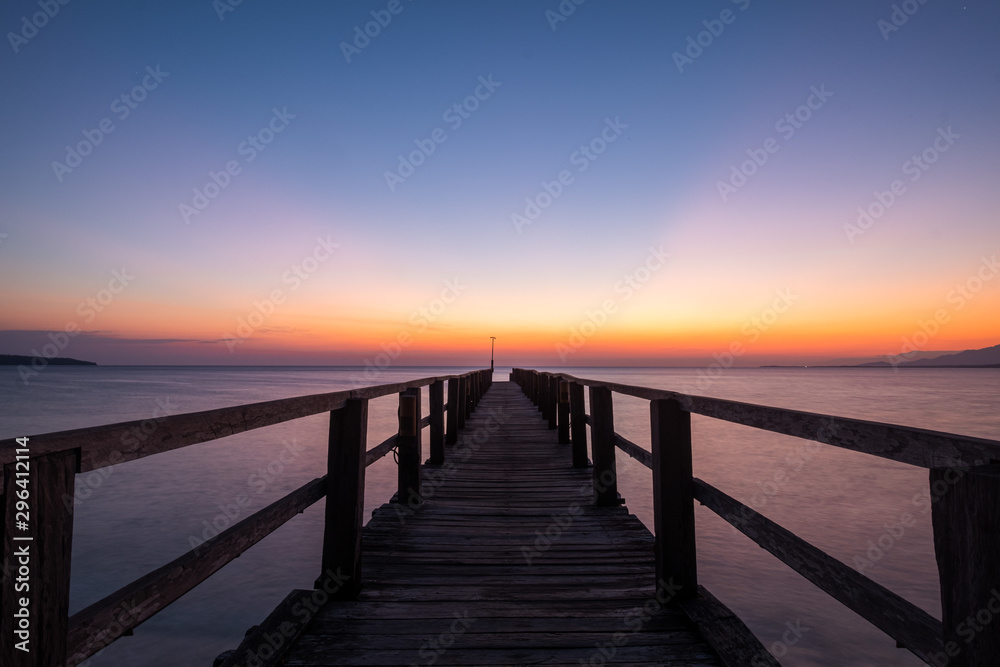 Sunrise at Bali Nation Park, at the beach with pier