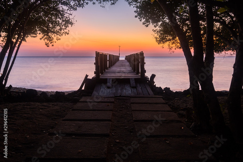 Sunrise at Bali Nation Park  at the beach with pier