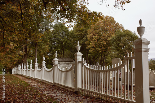 Historic cemetery behind a white picket fence in the New England town of Bennington, Vermont