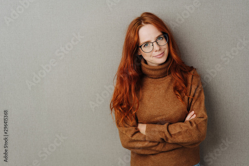 Sceptical young woman looking at the camera photo