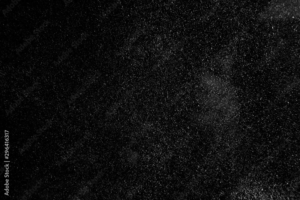 abstract real dust floating over black background for overlay - obrazy, fototapety, plakaty 