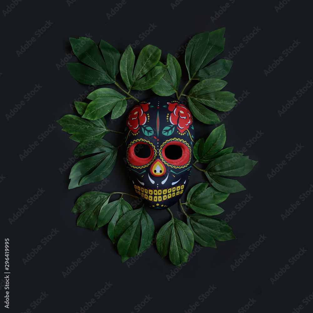 Sugar skull mask with flowers used for celebrating Day of the Dead in ...