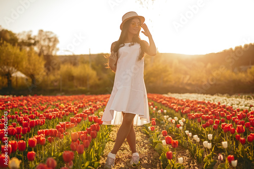 Sensual female standing in tulip field #296420743