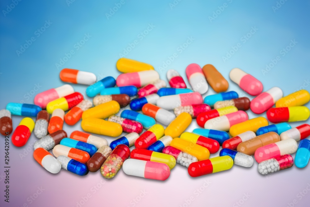 Colorful pills and tablets on background Colorful pills and tablets on background