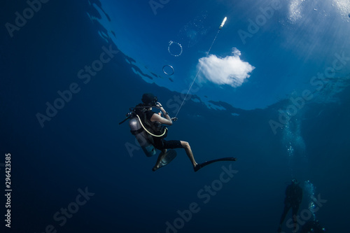 Diver Blowing Bubble Rings