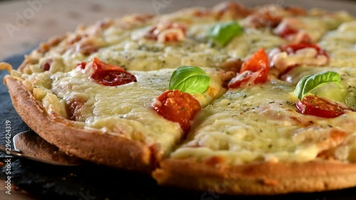 Italian pizza with mozzarella cheese, basil and cherry tomatoes