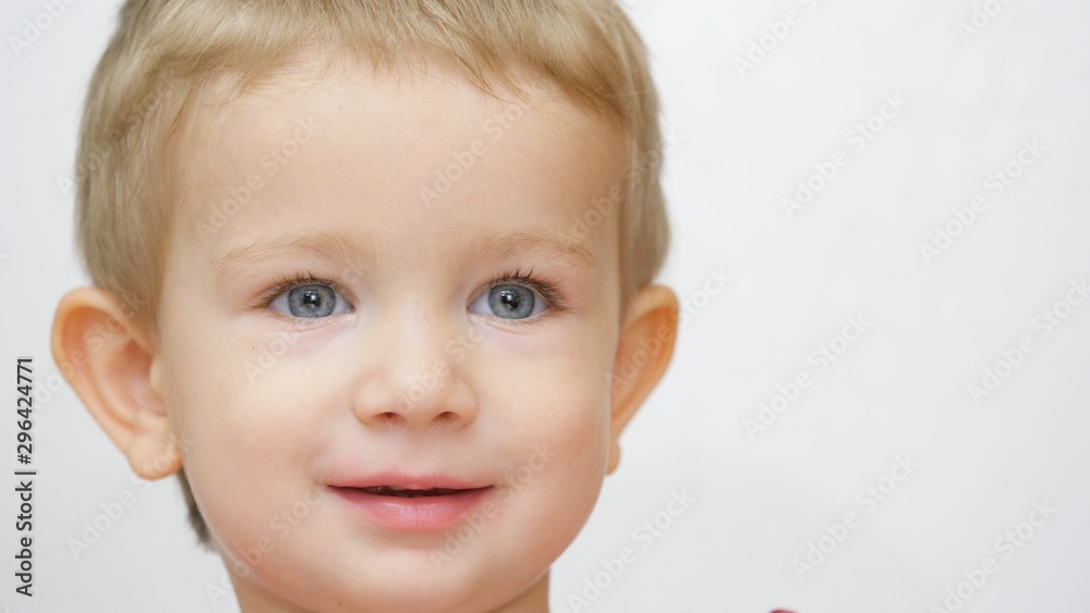 Cute blue eyes blond hair boy kid portrait