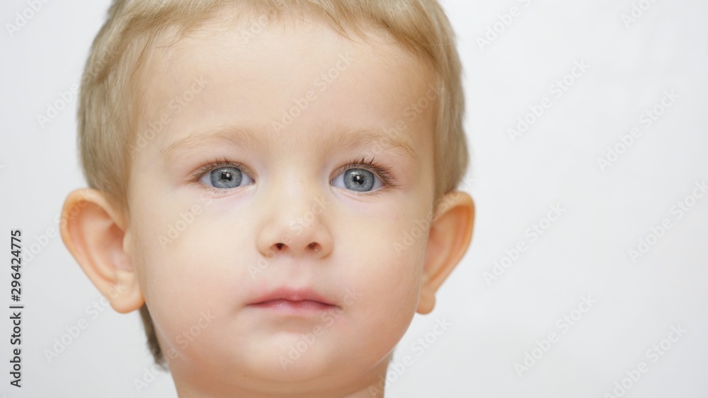 Portrait of happy child with blond hair and blue eyes, advertisement smile Portrait of happy child with blond hair and blue eyes, advertisement smile