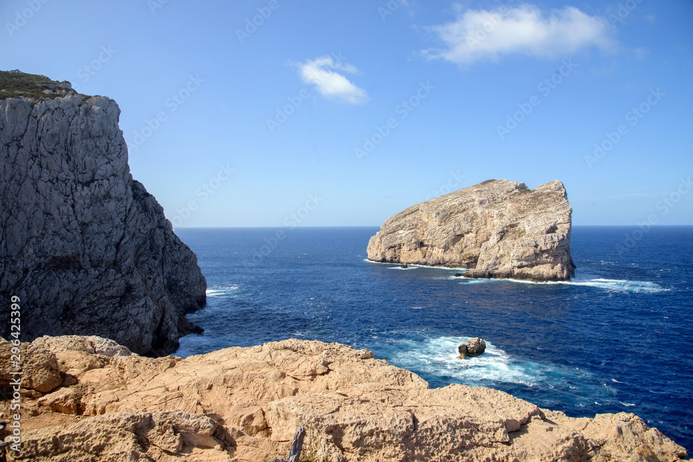 view of single rock in sea