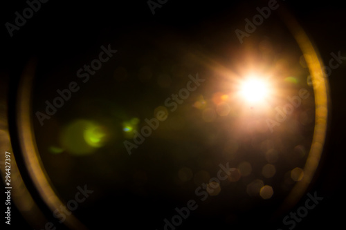 Photo abstract lens flare red light over black background