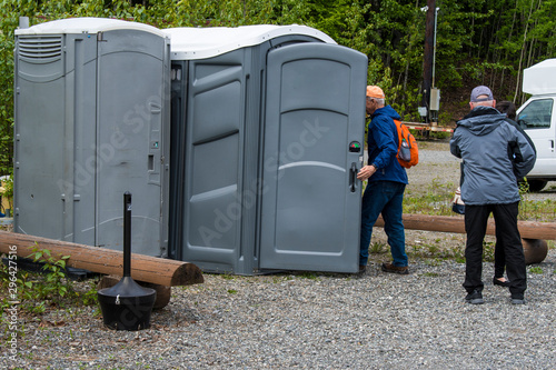 Man entering portable bathroom