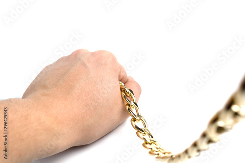 Golden chain in hands on a white background isolate