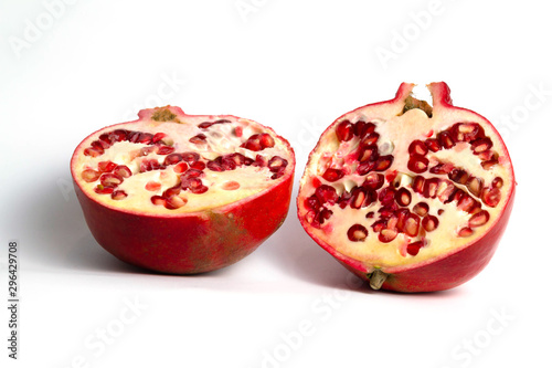 Red pomegranate half cutaway on a white background isolate